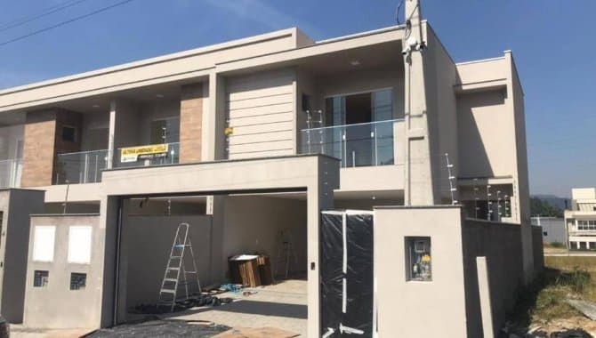 Foto 1 de 14: Casa em leilão em Gaspar - SC, bairro Gaspar Mirim — Casa em Condomínio 165 m² (01 vaga) - Gaspar Mirim - Gaspar - SC