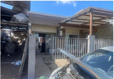 Terreno em leilão em Barra Velha - SC — fração ideal de 50% do imóvel com UMA CASA DE ALVENARIA e UM GALPÃO DE MADEIRA em Itajuba, Barra Velha/SC