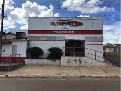 Foto 1 de 7: Comercial em leilão em Poxoréu - MT, bairro Novo Horizonte — IMÓVEL COMERCIAL | A.T. 1.660m² E A.C 1.059,40m² | POXORÉU/MT