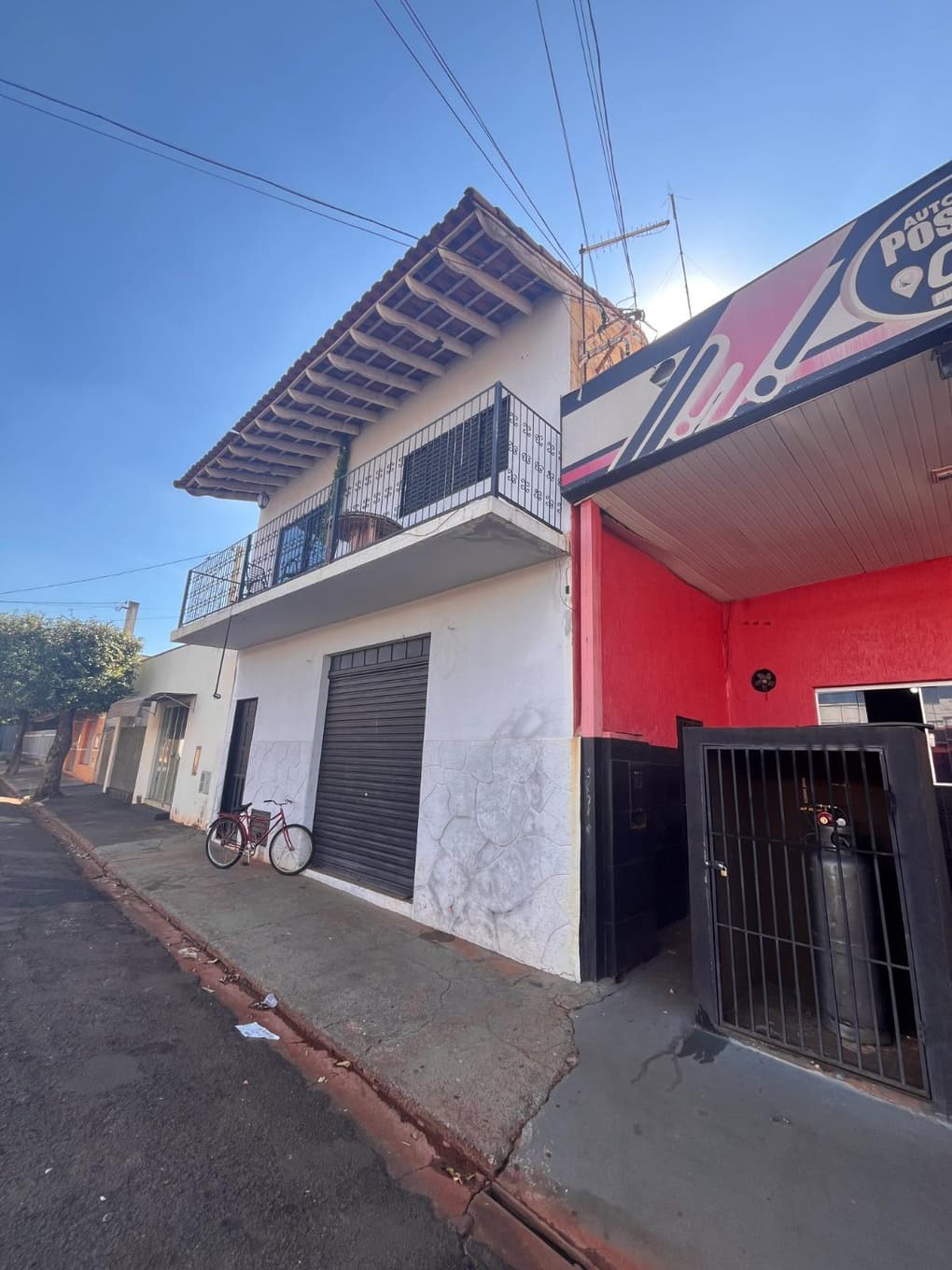 Foto 2 de 8: Comercial em leilão em Populina - SP, bairro Centro — IMÓVEL URBANO COM ESTRUTURA PARA POSTO DE COMBUSTÍVEL + IMÓVEL RESIDENCIAL - POPULINA-SP